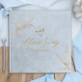 Księga welurowa ze złoconym napisem i grafiką gołąbka. Album na wklejane zdjęcia na Chrzest Święty.
