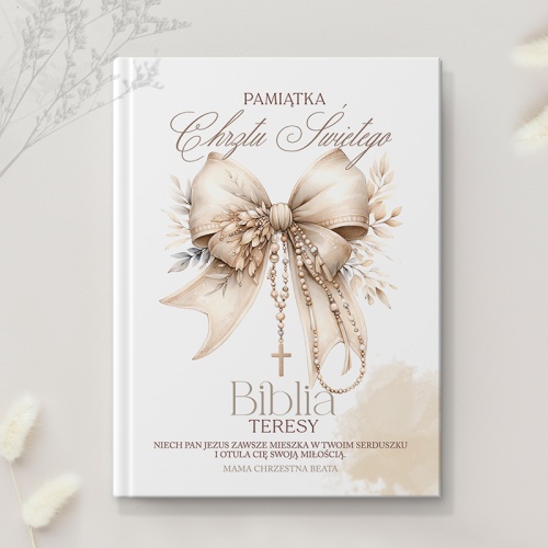 Biblia obrazkowa z personalizowaną okładką i grafiką przedstawiającą kokardę.