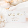 Prostokątny bilecik podziękowanie dla gości. Na białym tle są złote zdobienia - napis "Baby Shower", personalizacja i ozdobne kropeczki.