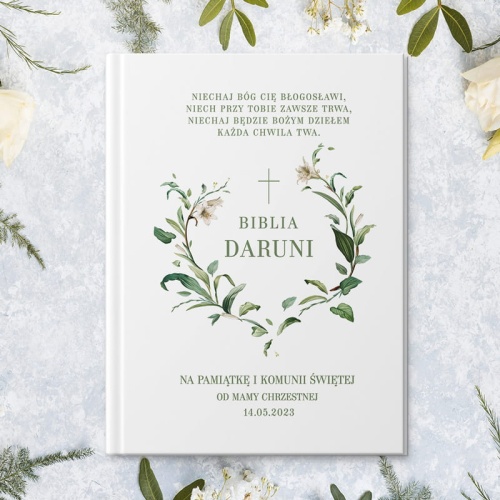 Komunijna biblia z personalizowaną okładką i grafiką lilii. Prezent komunijny dla dziecka.